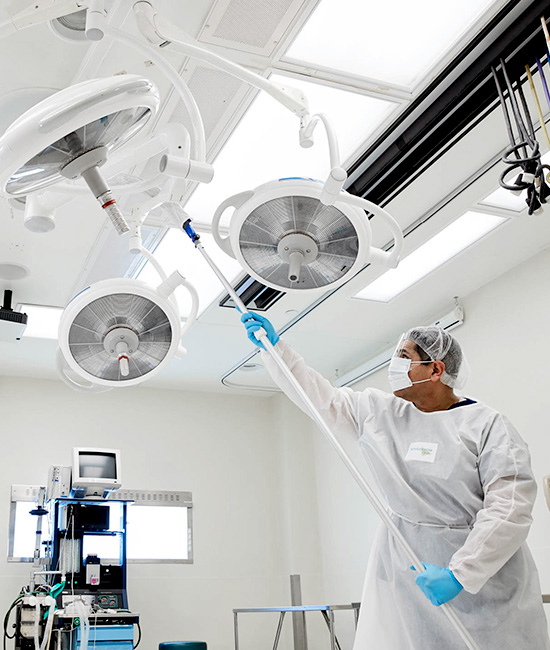 man cleaning hospital equiptment