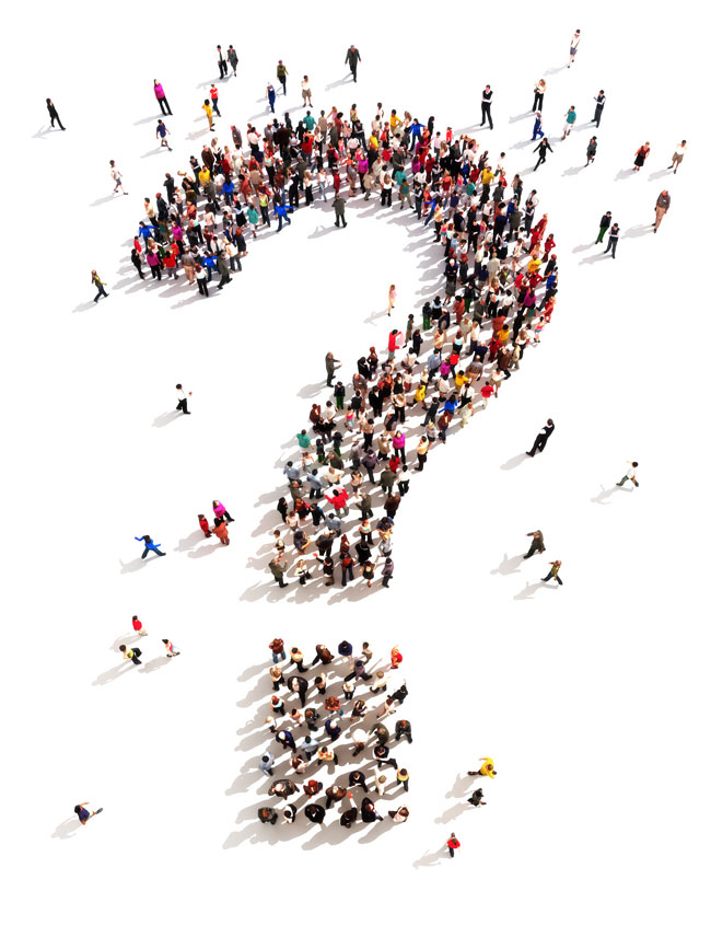 group of people standing in the shape of a question mark